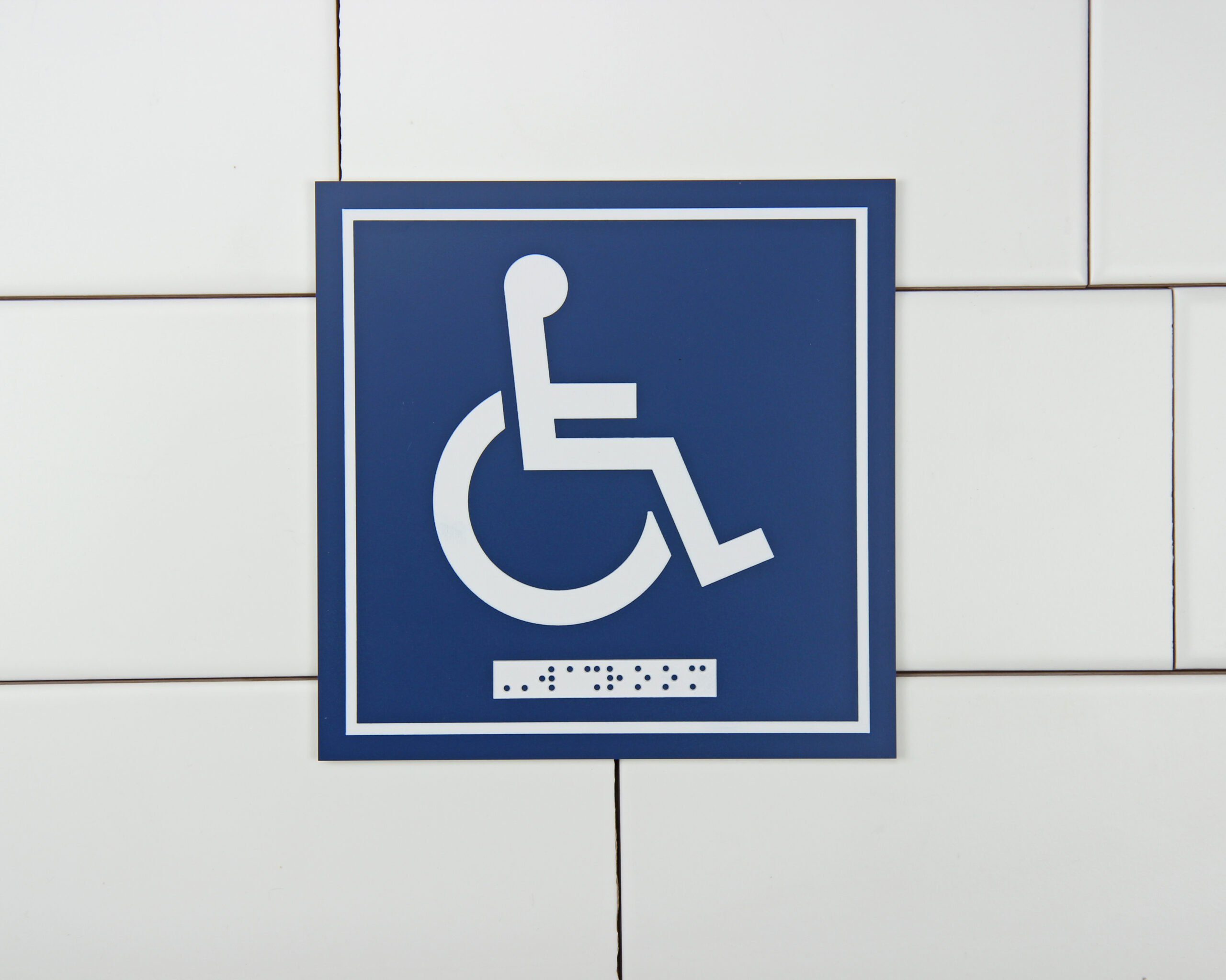 Washroom Signage – Wheelchair with Braille Emboss – Frost